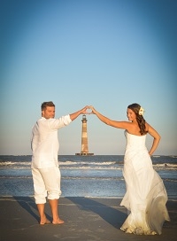 Hotel guests elopement ceremony with a view of Morris Island Lighthouse