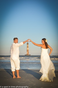 Hotel guests elopement ceremony with a view of Morris Island Lighthouse