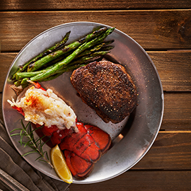 steak and lobster dinner flat lay composition